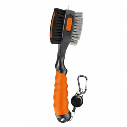 Dog grooming brush with orange handle and black bristles on a white background