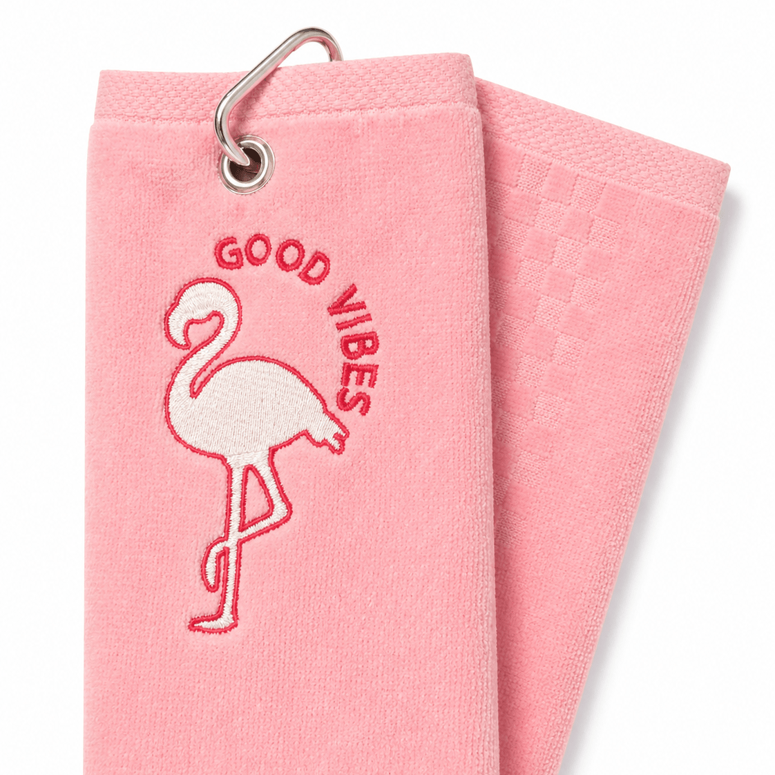 Pink towel with flamingo design and 'Good Vibes' text on a white background