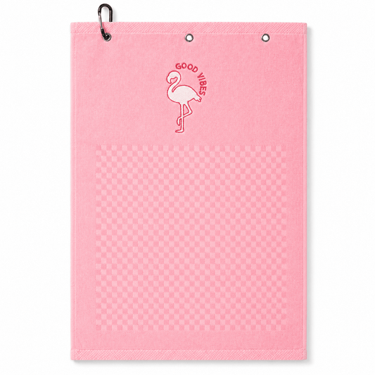 Pink towel with flamingo design and 'Good Vibes' text on a white background