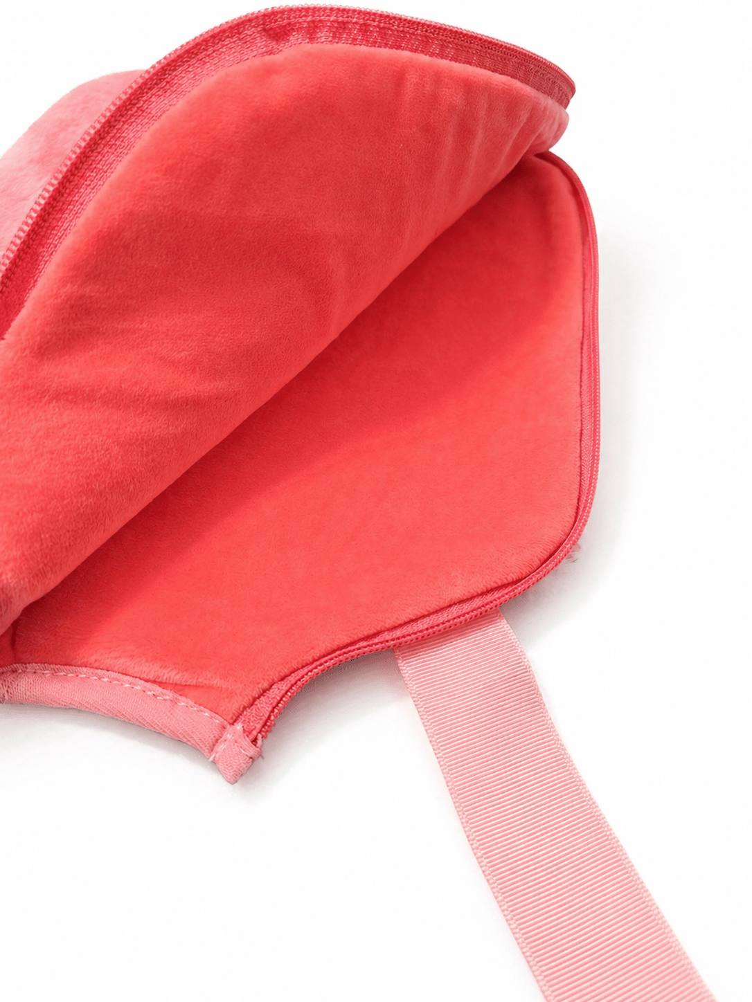 Close-up of a pink pouch with a strap on a white background