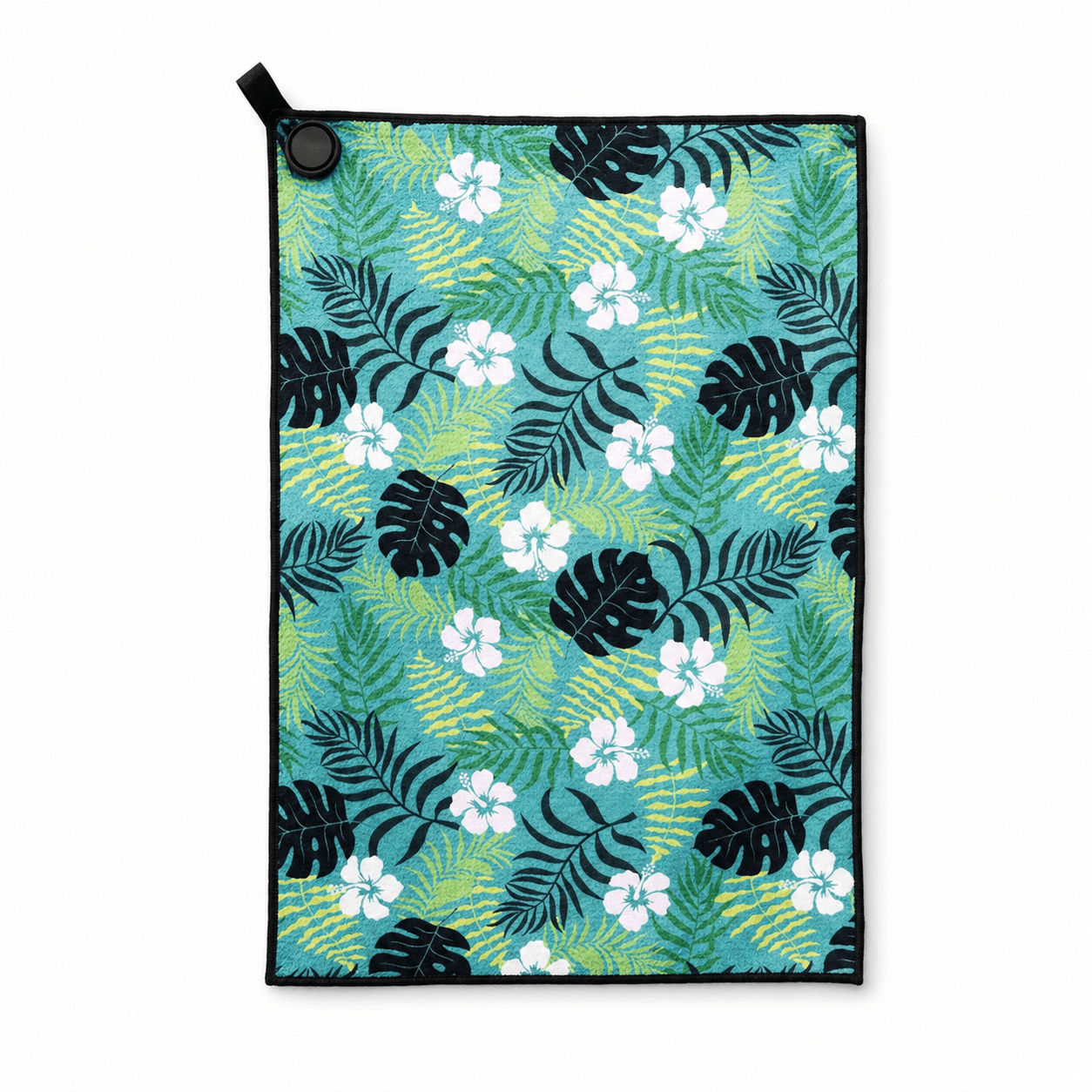 Towel with tropical leaf and flower pattern on a white background