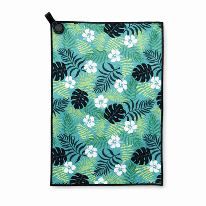 Towel with tropical leaf and flower pattern on a white background