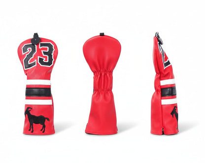 Red golf club head cover with black number 23 and goat silhouette on a white background