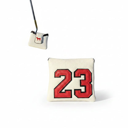 Golf marker with red numbers on grass