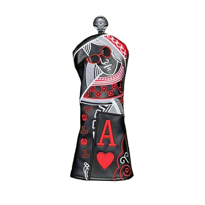Golf club head cover with playing card design on grass