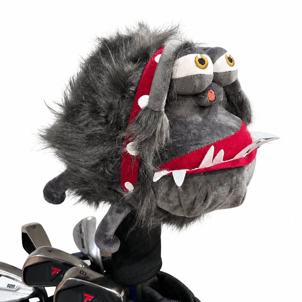 Golf club head cover with a cartoonish monster design on a white background