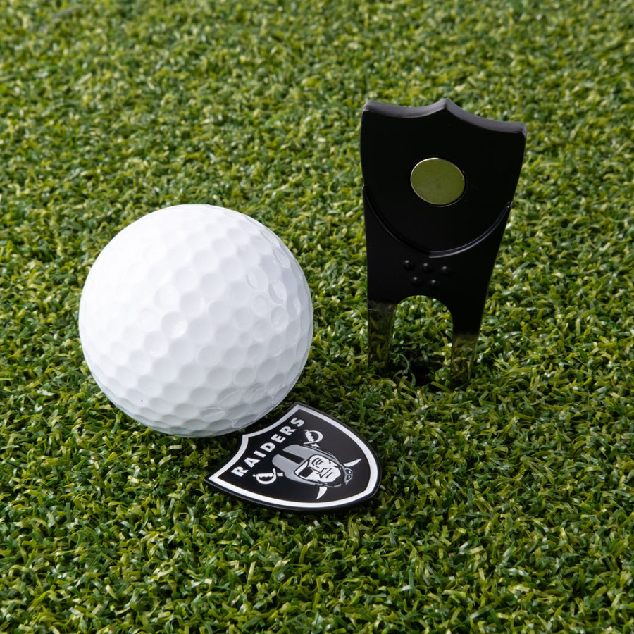 Las Vegas Raiders tool and its logo-shaped marker on the green