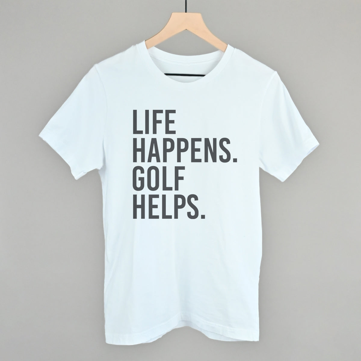 White Life Happens Golf Helps T-shirt with stacked black lettering