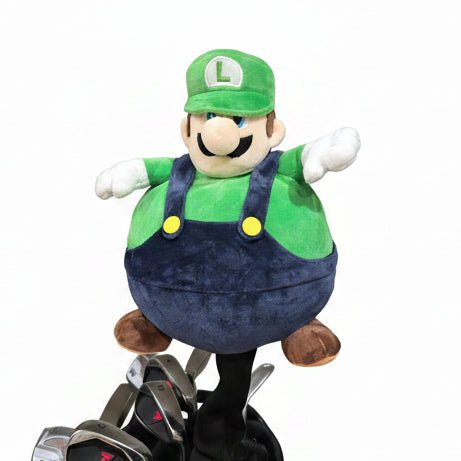 Plush toy resembling a character with a blue hat and green body on a motorcycle.