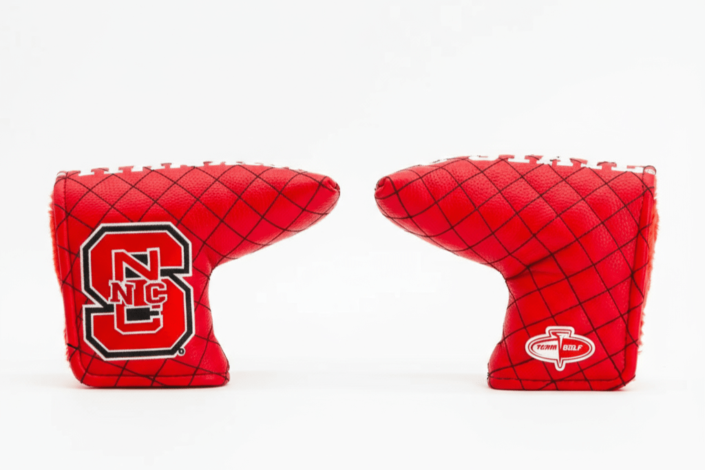 Two red golf club covers with logos on a white background