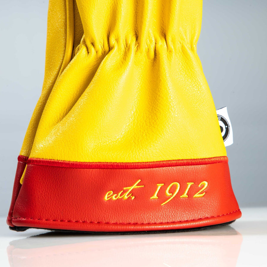 Red cuff with yellow est. 1912 embroidery on the New Mexico driver cover