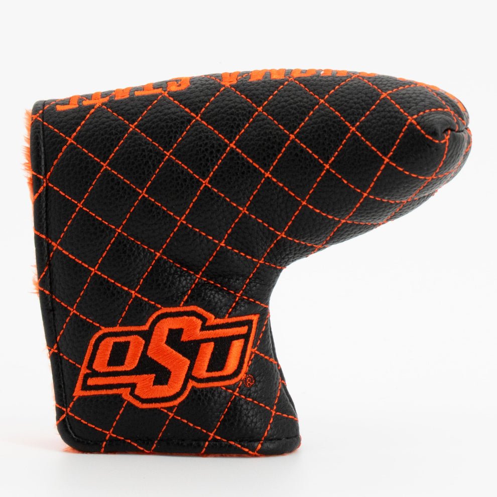 Golf club head cover with black and orange diamond pattern and 'OSU' logo on a white background