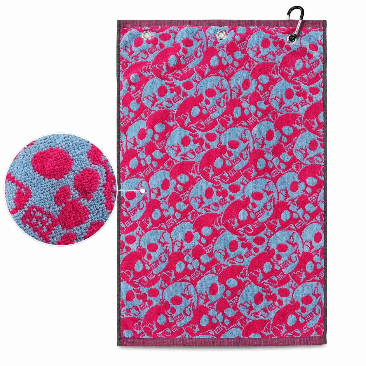 Towel with pink and blue skull pattern on a white background