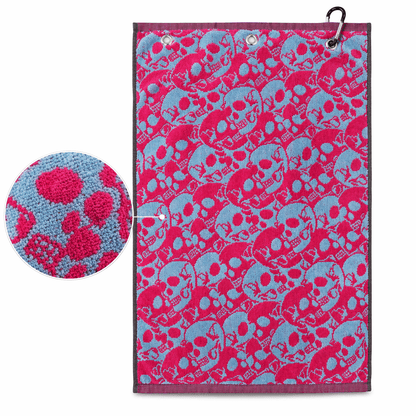 Towel with pink and blue skull pattern on a white background