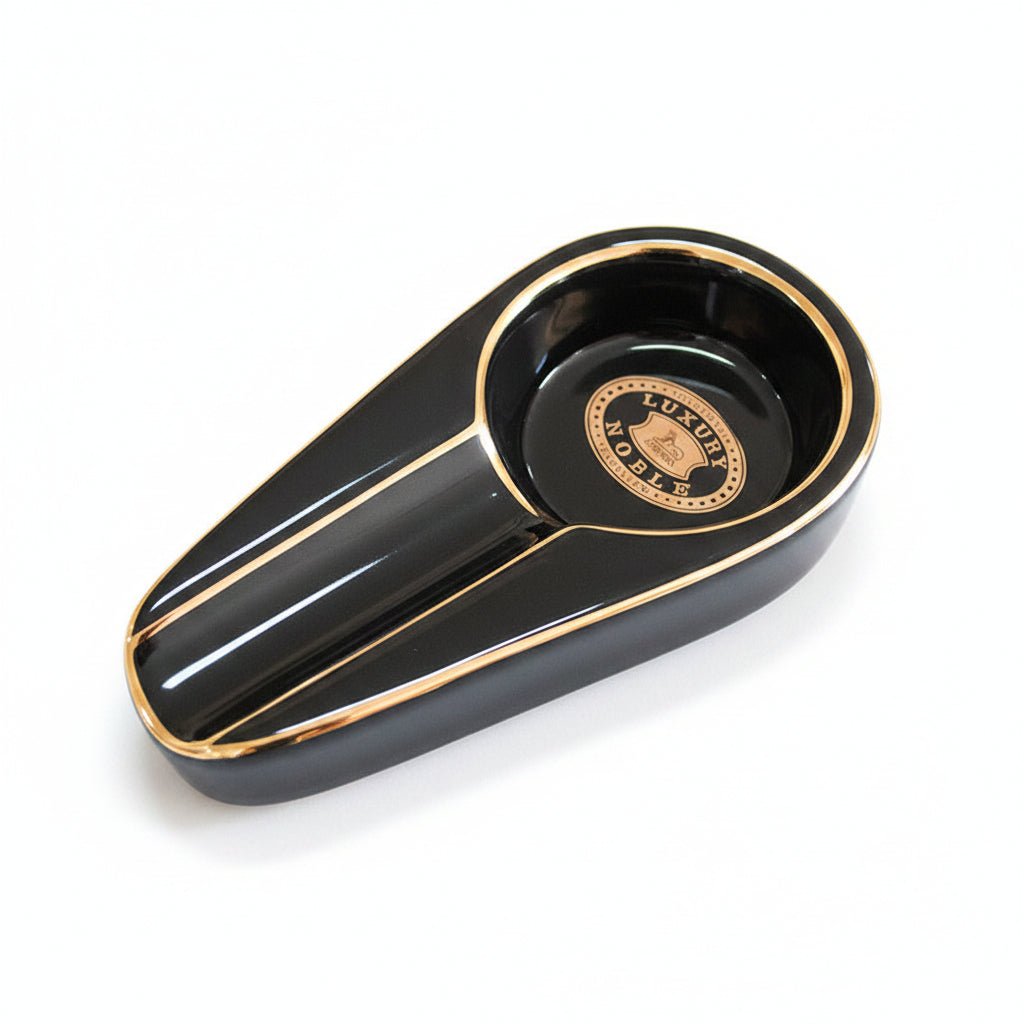 Black and gold decorative item on a textured black surface