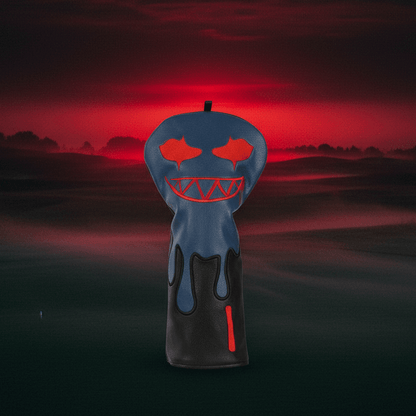 Horror-themed pumpkin with glowing red eyes and mouth against a dark, misty landscape.