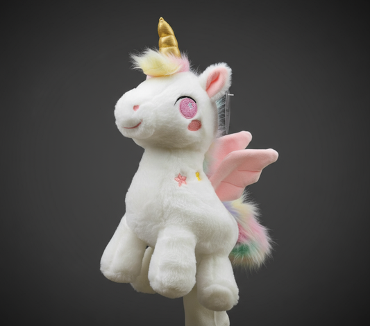Unicorn golf club headcover with golden horn, pink wings, and pastel tail on dark background