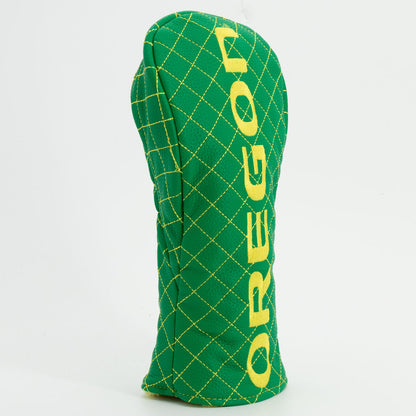 Green golf club head cover with 'OREGON' text on a white background