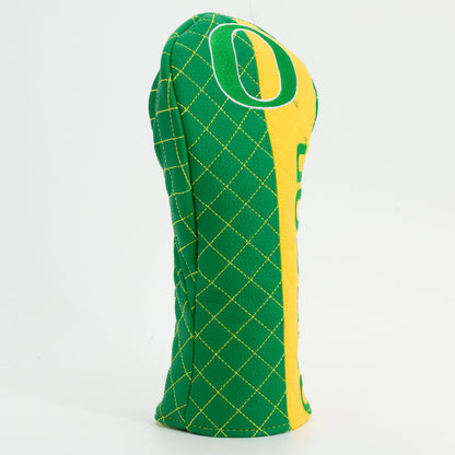 Green and yellow quilted golf club head cover with a large 'O' on a white background