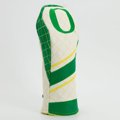 Golf club head cover with green and yellow design on a white background