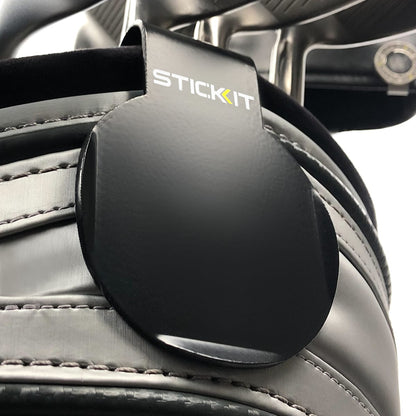 Black STICKIT landing pad clipped to a golf bag