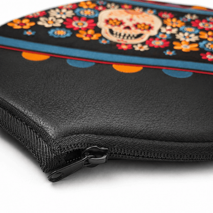 Black zippered pouch with colorful skull and floral design on a white background