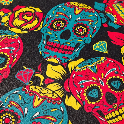 Round pouch with colorful skull and floral pattern on a black background
