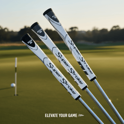 Three Super Stroke golf club heads on a golf course with a sunset background.