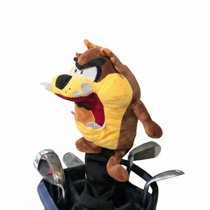 Plush toy resembling a cartoon character in a golf bag inside a garage.