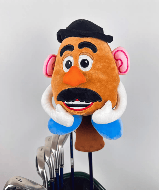Plush toy resembling a character with a mustache on a golf club head cover.