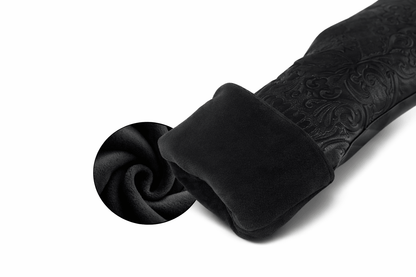 Black fabric with intricate texture on a white background