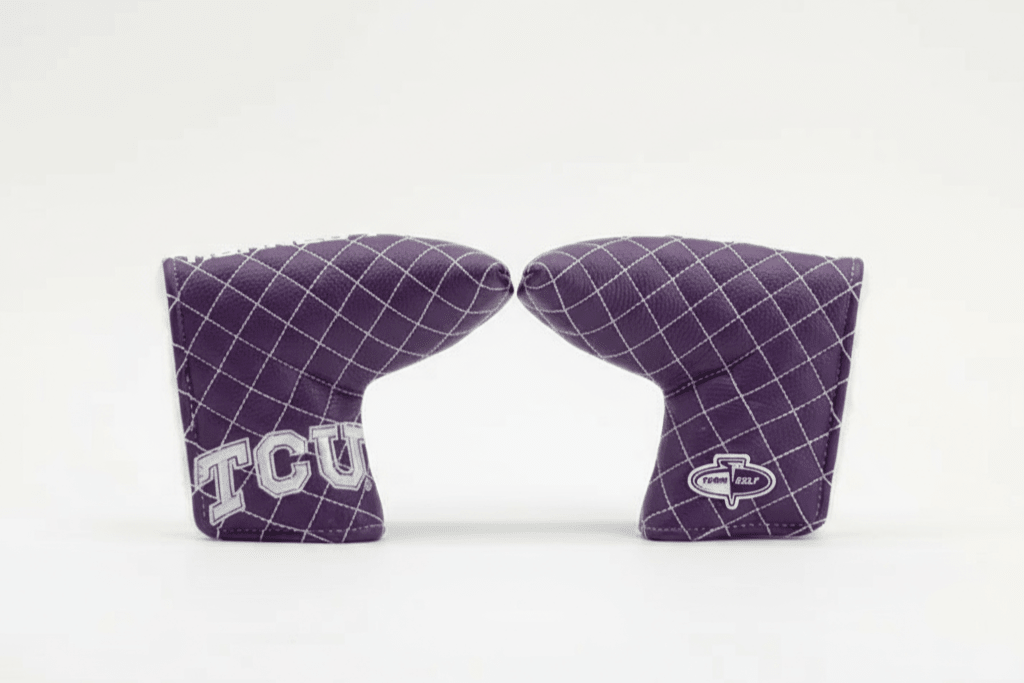 Two purple grid-patterned cornhole bags with 'TCU' and 'Cobra' logos on a white background