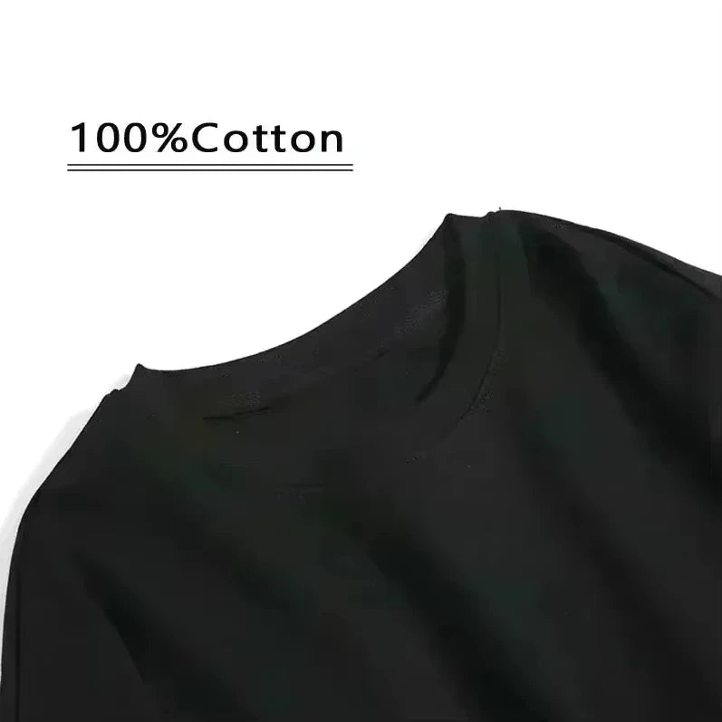 Close-up of black fabric with '100% Cotton' text on a white background