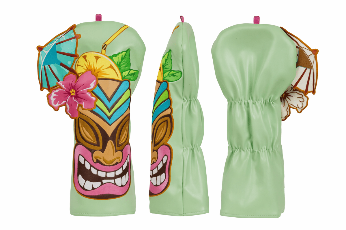 Green golf club covers with tiki mask design on a white background