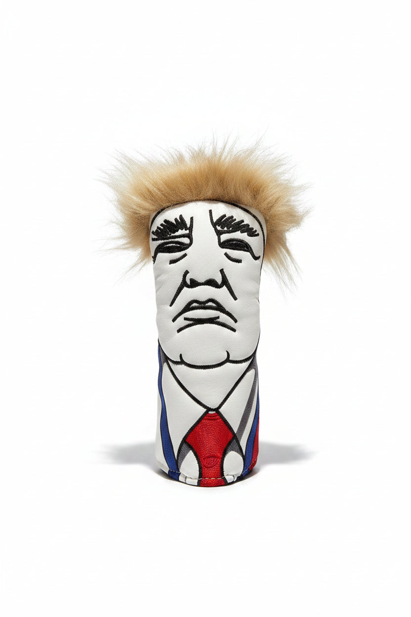 Colorful golf club head cover on a marble surface with a bottle of oil in the background.