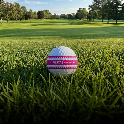 Volvik BCRF Vista3 Pink 360 golf balls in a lifestyle scene