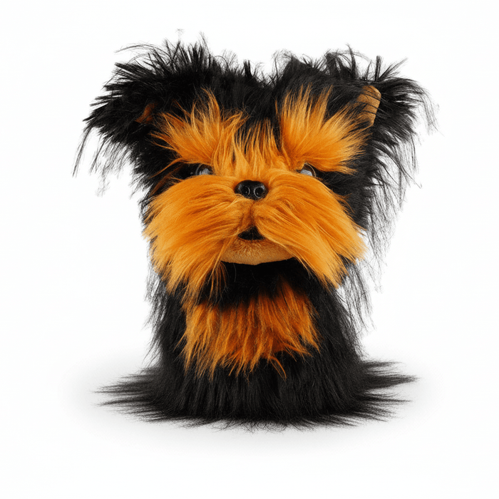 Plush dog head with black and orange fur on a white background